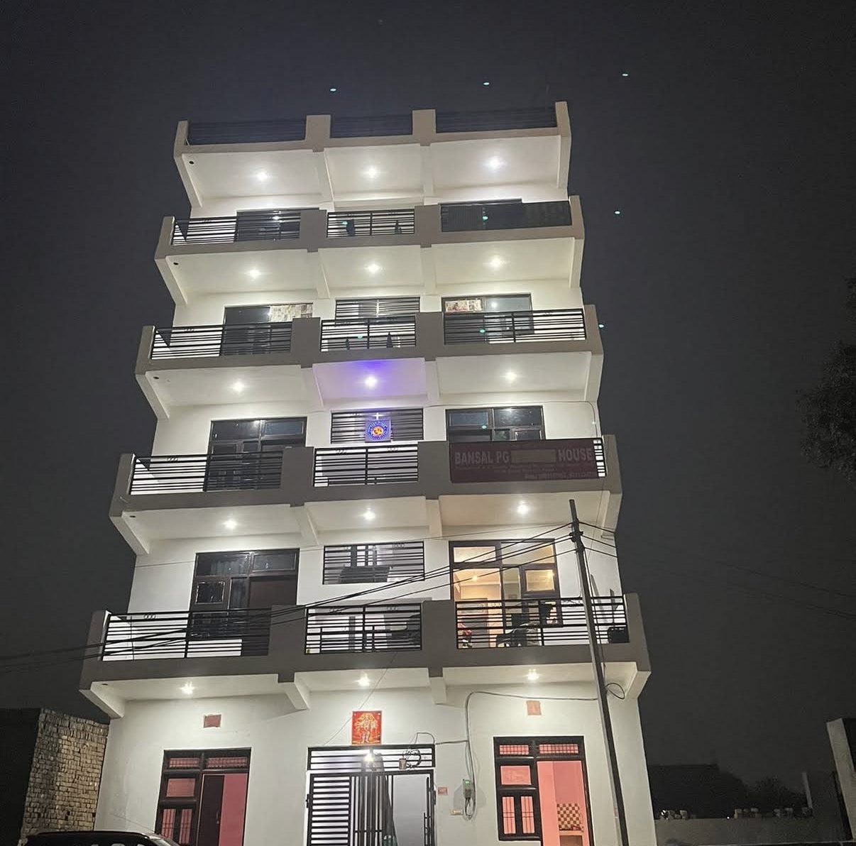 White House Bansal PG building lit up at night